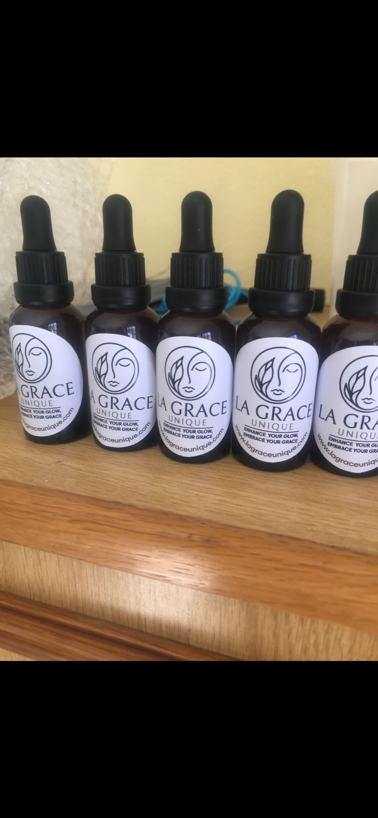 Dropper bottles carrying the earlier La Grace Unique brand